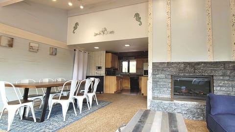 Dining area leading to the full kitchen.