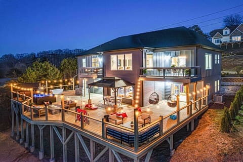2k sq foot lit up deck w/ scenic mountain views and:
-8 person hot tub
-6 person barrel sauna
-2 person cold plunge
-gas grill
-dining for 10
-fireplace
-chaise lounge and seating
-cornhole, KanJam & more
