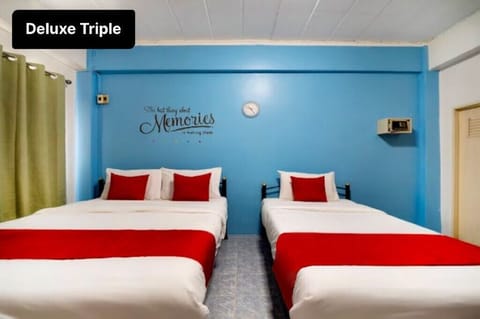 Deluxe Triple Room | Minibar, in-room safe, desk, free WiFi