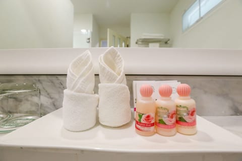 Combined shower/tub, designer toiletries, hair dryer, bathrobes