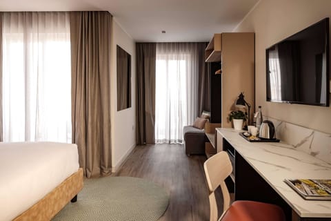 Deluxe Room, 1 Bedroom, City View | 1 bedroom, in-room safe, free WiFi, bed sheets