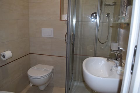 Basic Double Room, 1 Queen Bed, Sea View | Bathroom | Shower, hair dryer, bidet, towels