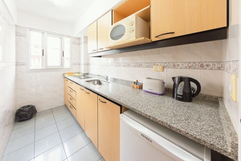 Apartment, 1 Bedroom, City View | Private kitchen | Mini-fridge, microwave, coffee/tea maker, griddle