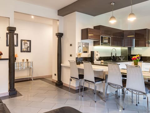 Property, Furniture, Cabinetry, Table, Building, Picture Frame, Lighting, Interior Design, Countertop, Architecture