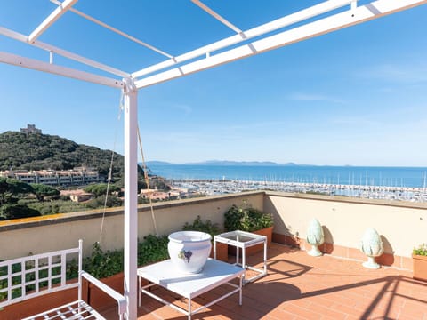 Sky, Building, Property, Furniture, Water, Azure, Shade, Outdoor Furniture, Seaside Resort, Chair