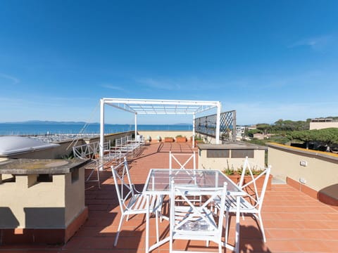 Sky, Property, Building, Shade, Wood, Water, Urban Design, Tree, Roof, Facade