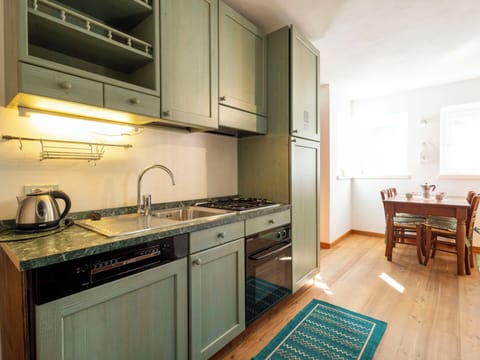 Kitchen, Countertop, Kitchen Appliance, Cabinetry, Interior Design, Major Appliance, Furniture, Wood, Flooring, Ceiling