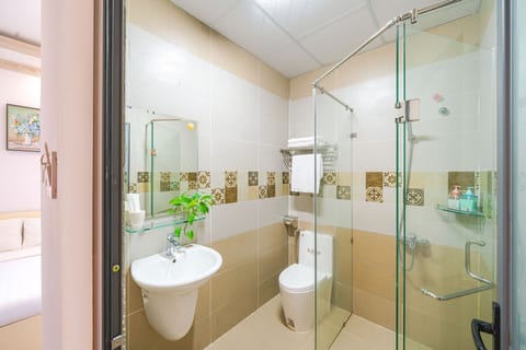 Family Room, 2 Queen Beds, City View | Bathroom | Shower, hydromassage showerhead, designer toiletries, hair dryer