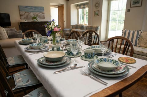 Living room with dining table laid for dinner