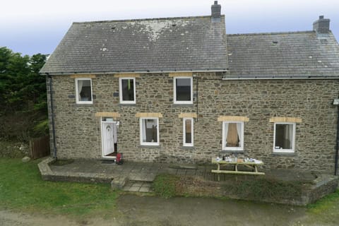 The outside of Brynonnen with picnic bench in the front garden