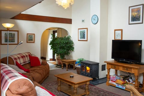 Coffee table, wood burner and TV