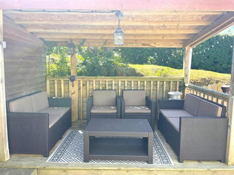 outdoor furniture under pergola in garden