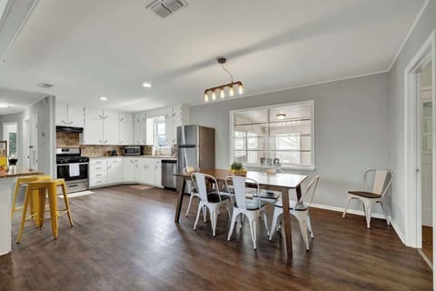 Dining area and kitchen flow seamlessly.