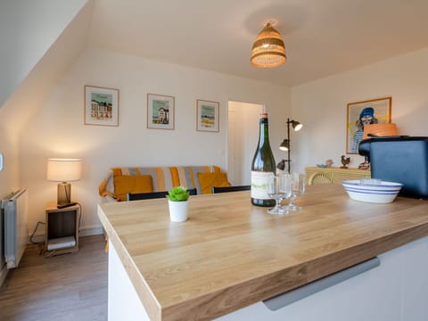 Table, Property, Furniture, Bottle, Wood, Azure, Drinkware, Lighting, Architecture, Cabinetry