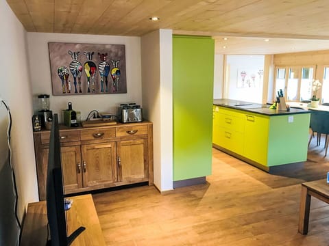 Furniture, Interior Design, Flooring, Wood, Floor, Ceiling, Kitchen, Wood Flooring, Countertop, Lighting