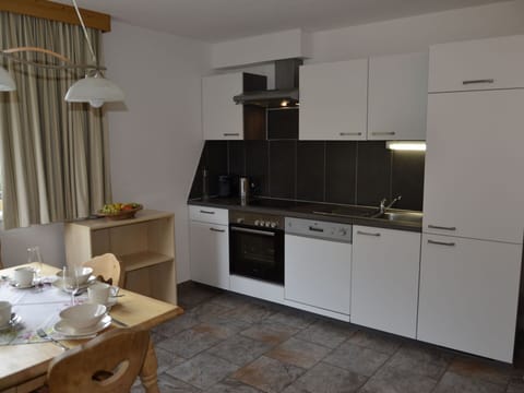 Cabinetry, Furniture, Tap, Kitchen Sink, Countertop, Sink, Kitchen Stove, Tableware, Kitchen Appliance, Interior Design