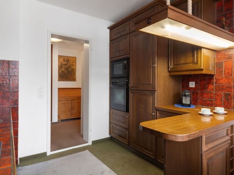 Cabinetry, Interior Design, Furniture, Flooring, Countertop, Wood, Ceiling, Kitchen, Floor, Light Fixture