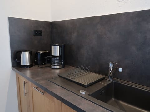 Cabinetry, Countertop, Kitchen Appliance, Kitchen, Home Appliance, Kitchen Stove, Wall, Flooring, Stove, Wood Stain