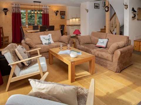 Furniture, Interior Design, Flooring, Floor, Couch, Wood, Room, Table, Wood Flooring, Living Room