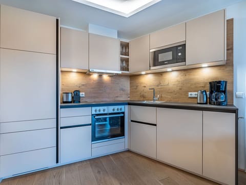 Countertop, Cabinetry, Property, Furniture, Kitchen Appliance, Kitchen Stove, Building, Kitchen, Home Appliance, Wood