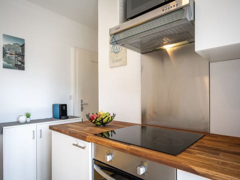 Property, Cabinetry, Building, Wood, Interior Design, Kitchen, Countertop, Picture Frame, House, Flooring