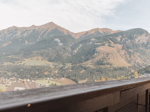Cloud, Sky, Mountain, Ecoregion, Highland, Asphalt, Road Surface, Slope, Tree, Landscape