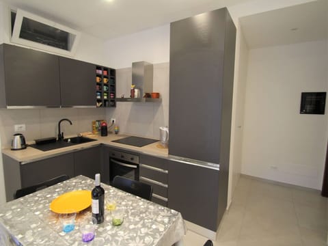 Cabinetry, Countertop, Property, Furniture, Sink, Tap, Table, Kitchen, Kitchen Stove, Building