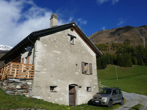 Cloud, Sky, Plant, Car, Building, Window, Vehicle, Mountain, Land Lot, House