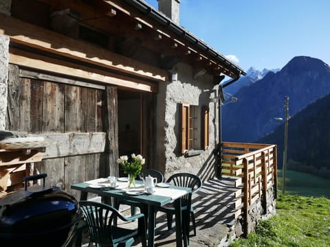 Building, Plant, Property, Window, Sky, Table, Mountain, Wood, House, Flowerpot