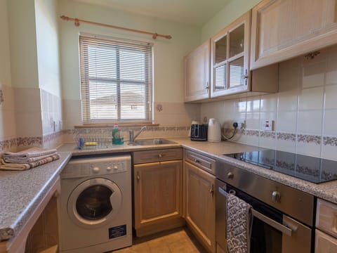 Laundry Room, Cabinetry, Property, Washing Machine, Kitchen Sink, Window, Sink, Countertop, Clothes Dryer, Kitchen Stove
