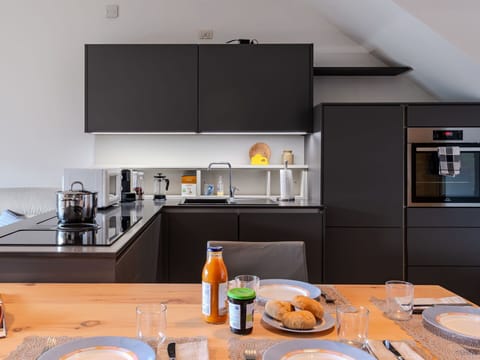 Food, Table, Countertop, Property, Tableware, Cabinetry, Dishware, Interior Design, Orange, Kitchen