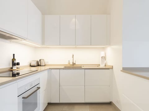 Cabinetry, Countertop, Tap, Furniture, Property, Sink, Kitchen, Interior Design, Wood, Flooring