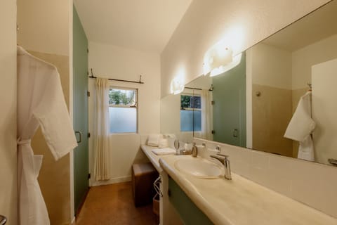 King Suite | Bathroom | Shower, rainfall showerhead, hair dryer, bathrobes