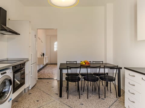 Furniture, Laundry Room, Property, Cabinetry, Table, Countertop, Wood, Lighting, Clothes Dryer, Chair