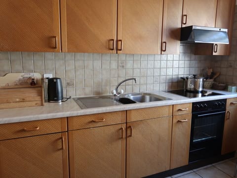 Brown, Tap, Kitchen Sink, Countertop, Sink, Cabinetry, Plumbing Fixture, Kitchen, Wood, Interior Design