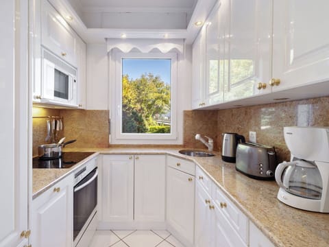 Countertop, Kitchen, Interior Design, Kitchen Appliance, Cabinetry, Wood, Plumbing Fixture, Major Appliance, Flooring, Home