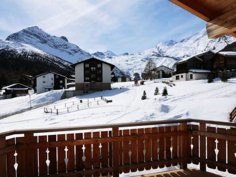 Sky, Cloud, Snow, Mountain, Property, White, Building, Window, Slope, House