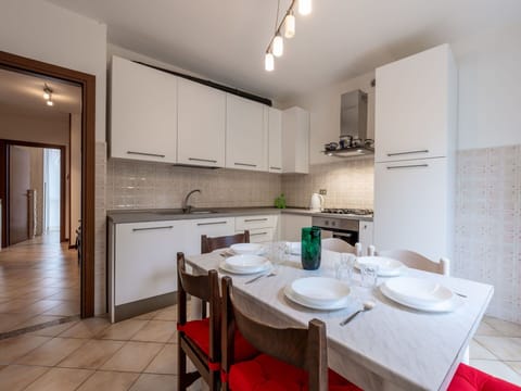 Cabinetry, Table, Property, Furniture, Countertop, Kitchen, Interior Design, Wood, Tableware, Floor