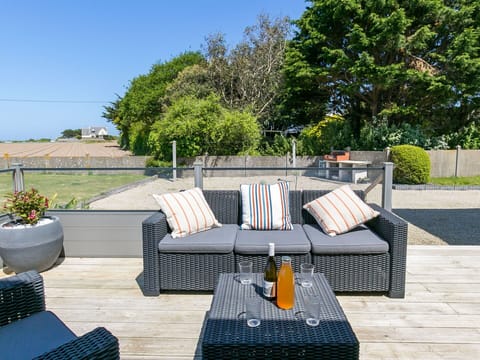 Plant, Table, Property, Furniture, Couch, Sky, Outdoor Furniture, Tree, Outdoor Table