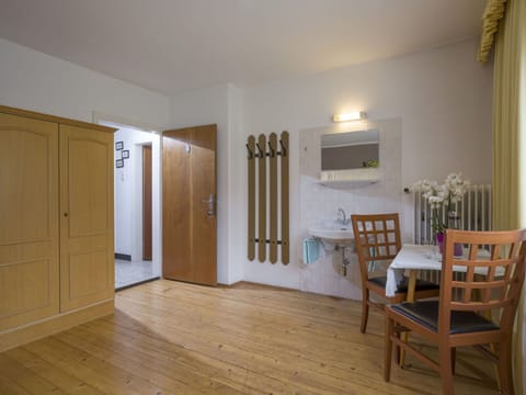 Building, Plant, Door, Wood, Chair, Houseplant, Interior Design, Flooring, Hall, Table