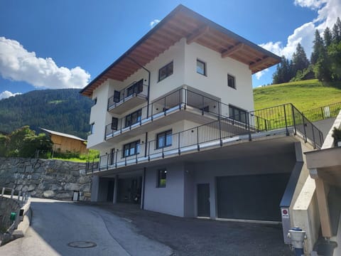 Sky, Building, Cloud, Property, Window, House, Architecture, Urban Design, Tree, Plant