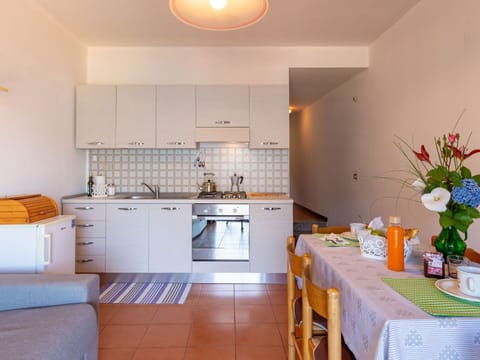 Cabinetry, Furniture, Table, Property, Countertop, Sink, Interior Design, Orange, Kitchen, House