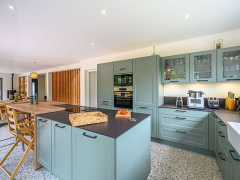 Cabinetry, Countertop, Furniture, Kitchen Appliance, Kitchen Stove, Kitchen, Home Appliance, Drawer, Wood, Lighting