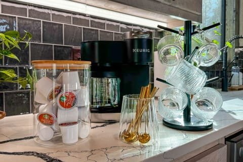 Grab your morning coffee from the fully stocked coffee bar with Keurig Duo coffeemaker that offers both K-cup and drip-coffeemaking options, along with starter set of K-cups, ground coffee, sugar, and creamer.