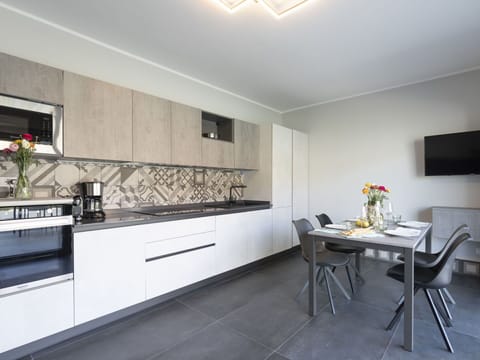 Cabinetry, Furniture, Property, Building, Countertop, Tap, Table, Interior Design, Wood