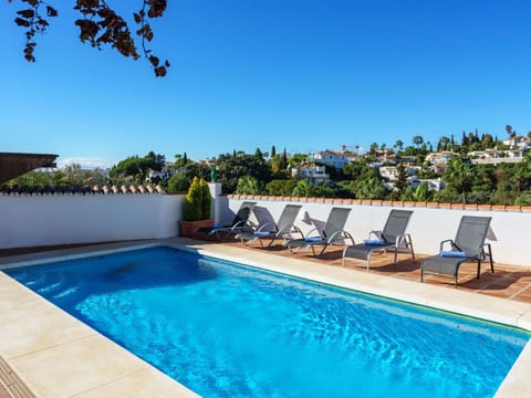 Water, Plant, Sky, Property, Swimming Pool, Azure, Shade, Outdoor Furniture, Tree, Chair