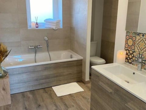 Luxury Loft | Bathroom | Hair dryer, bathrobes