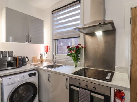 Fridge, electric kettle, toaster, cookware/dishes/utensils