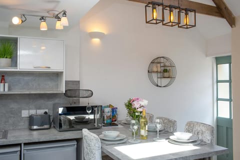 Front door leading to kitchen area. Original A frame beams