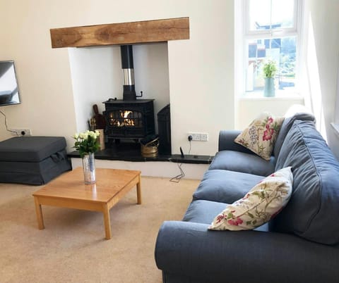 Lounge with log burner, sofa, coffee table